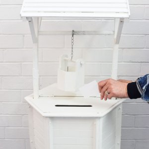 white wishing well with bucket