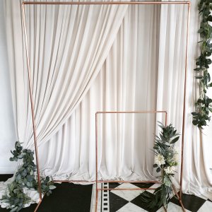 Taupe-backdrop-with-copper-arch