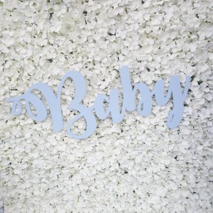 Wood cut out baby sign painted in a pale baby blue colour
