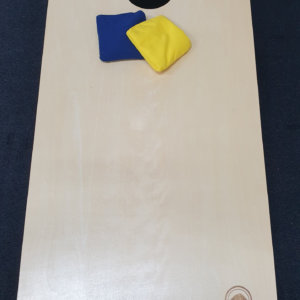 Corn Toss Game with yellow and blue bags to toss.